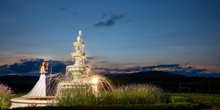 bride and groom fountain sunset photo
