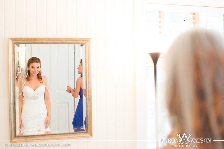 bride looking in mirror