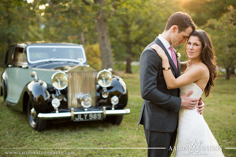 bride and groom with roles royce