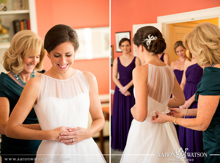 tying bow on wedding dress