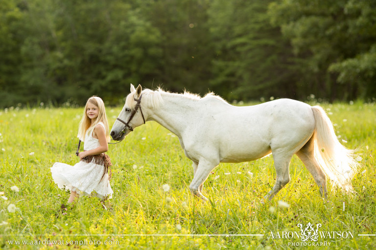 girl leading horse