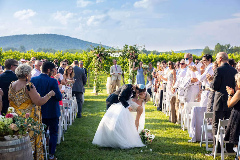ceremony recessional bride and groom kissing